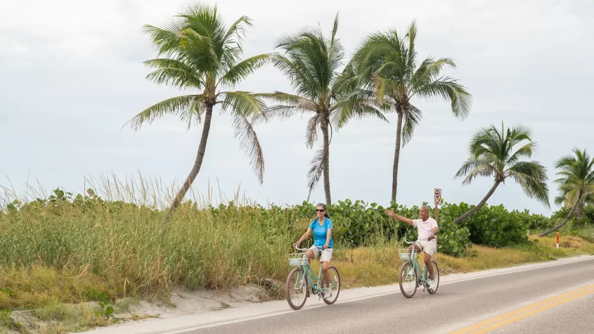 Couple riding their bikes along Captiva Dr