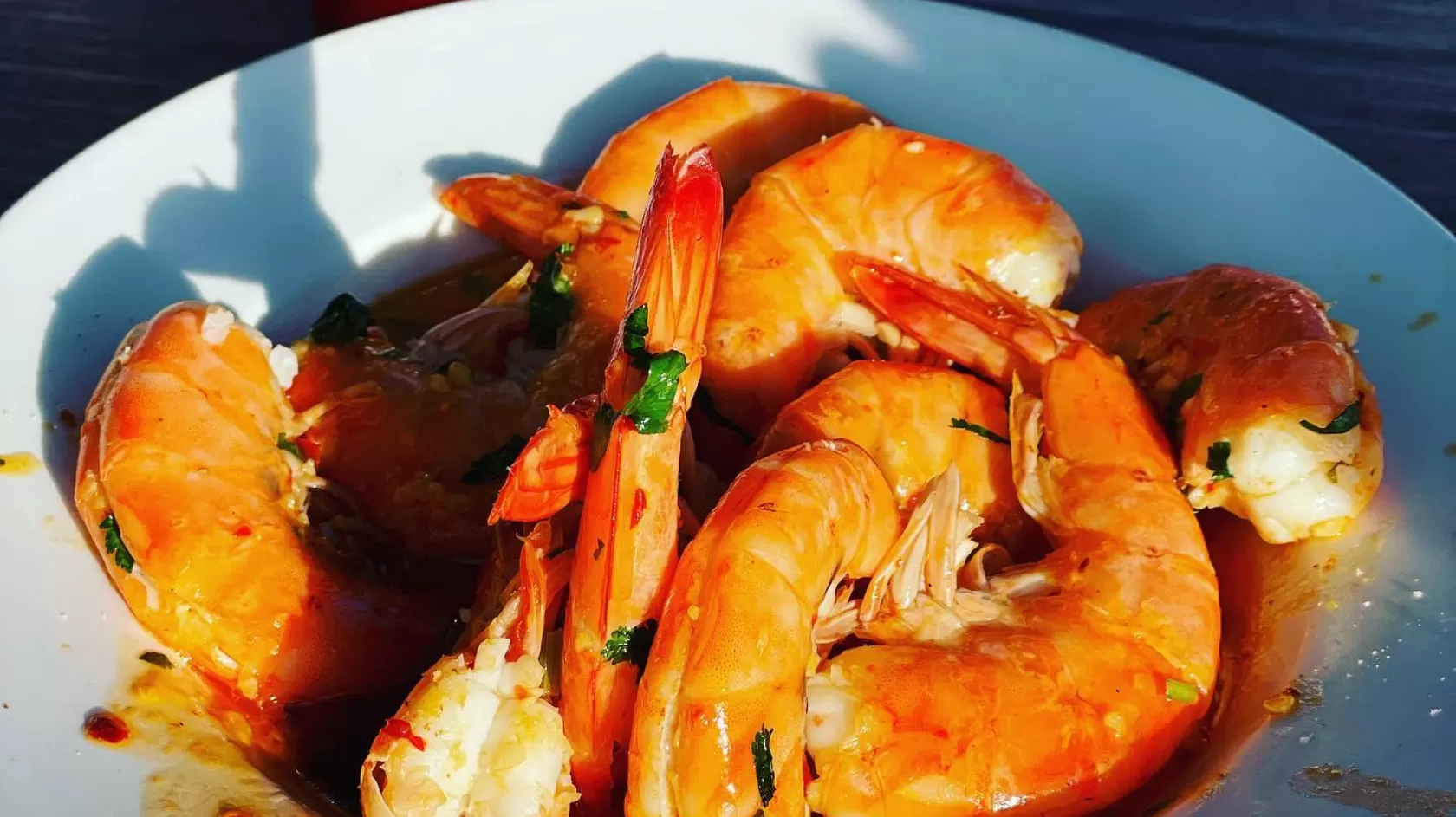 shrimp at doc fords with drink on table