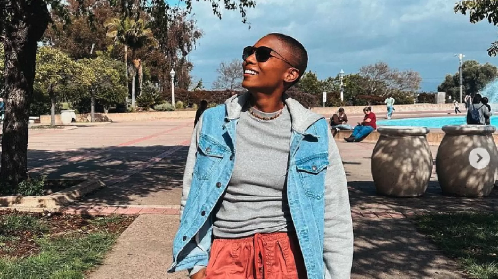 A woman enjoys a walk in a park