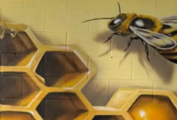A 3D mural featuring a beehive and bees in North Fort Myers